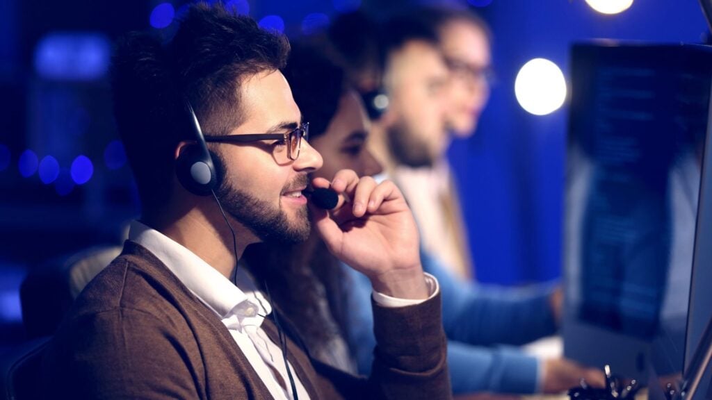 A photo of a man working on a computer.