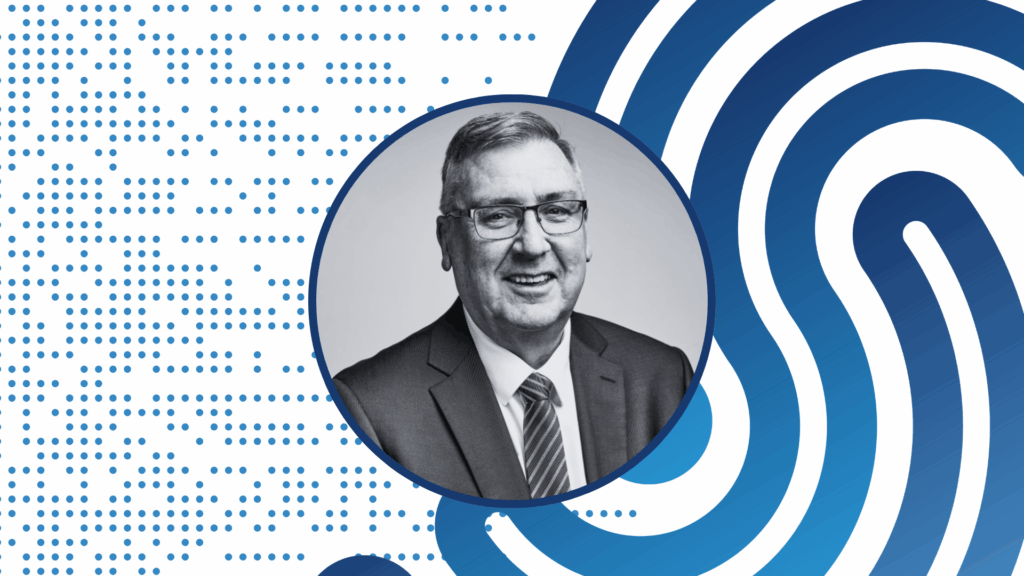 Photo of a person smiling at the camera.