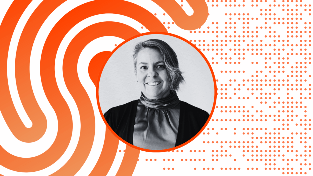 Photo of a person smiling at the camera.