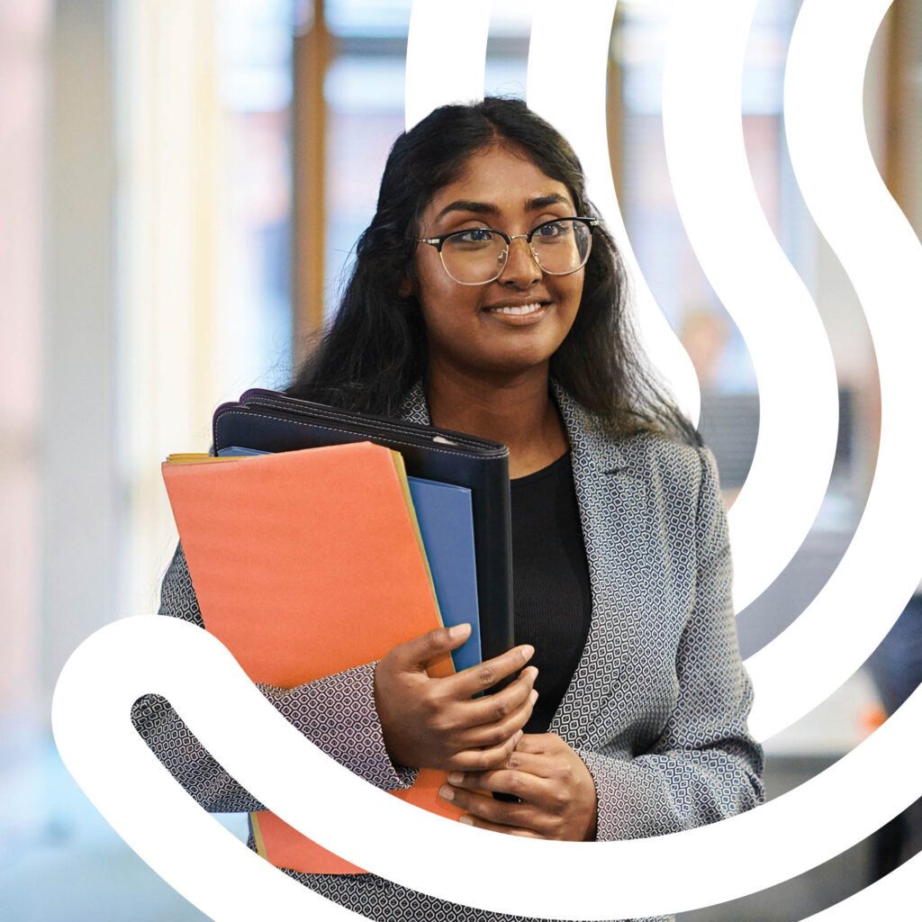 Young woman walking through an office.