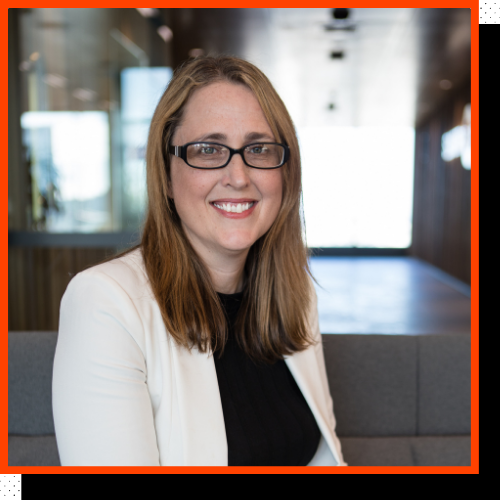 Photo of a woman smiling at the camera.